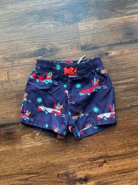 Circo Navy Swim Shorts with Red and Teal Airplane Print